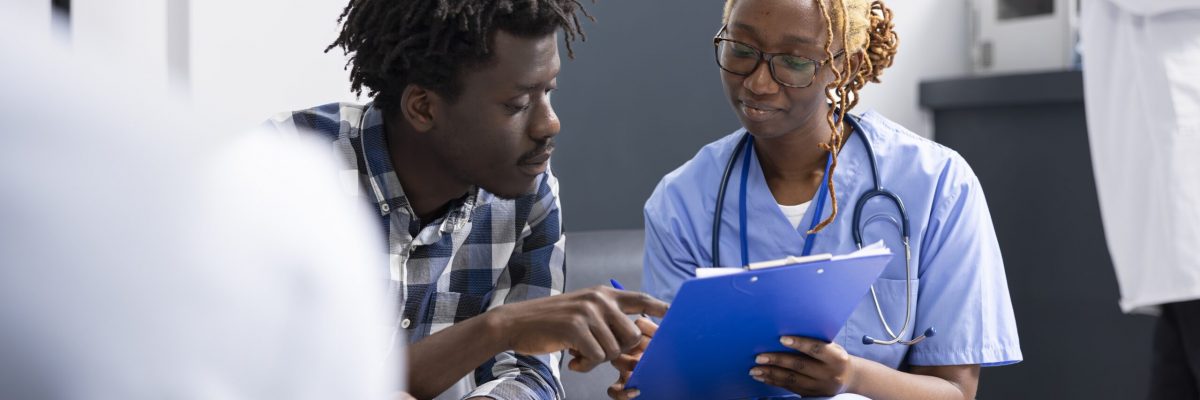 A healthcare professional and a patient engaged in conversation.